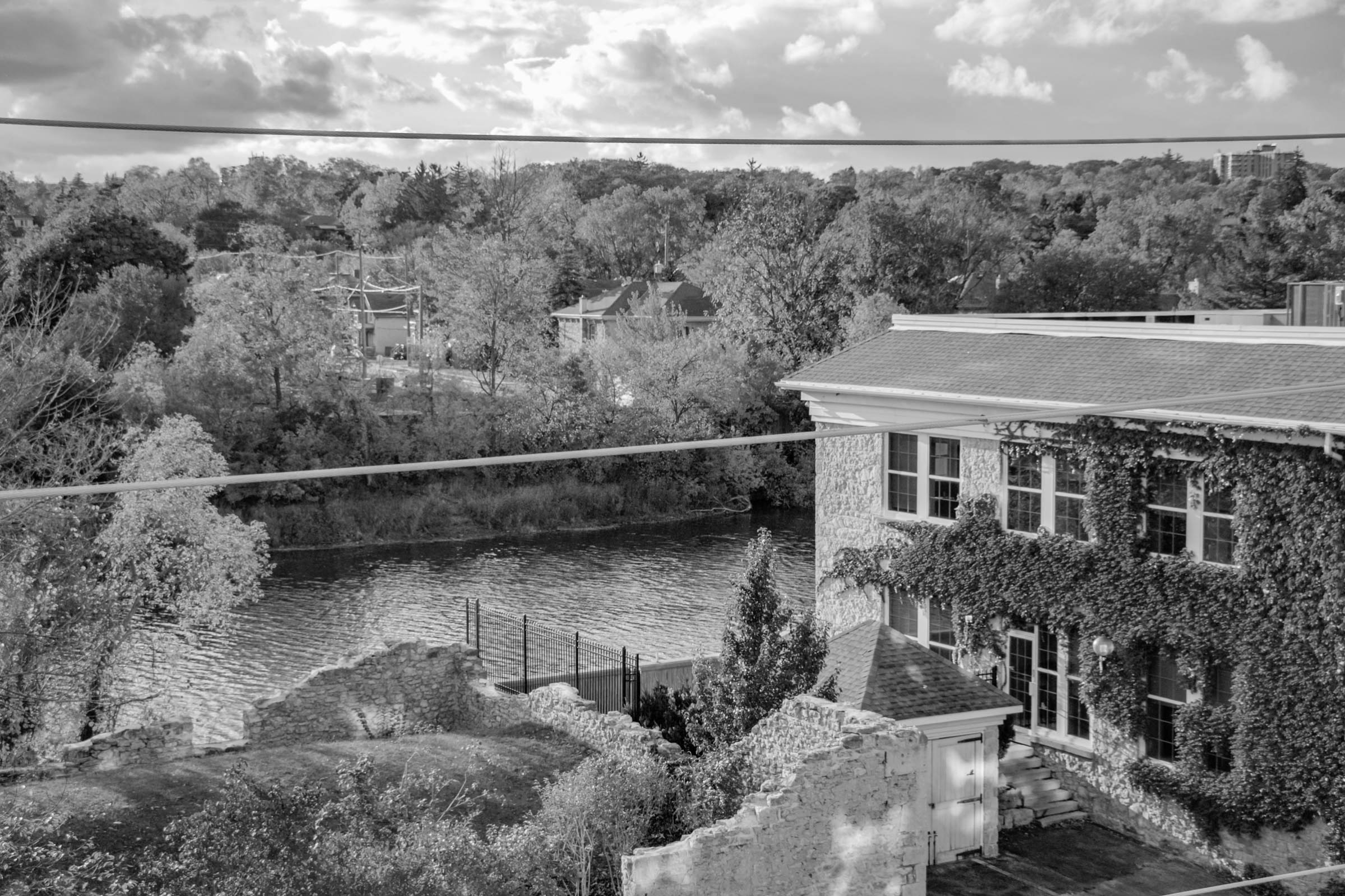looking at the grand river with buildings in front in the glenview lincoln area of east galt, cambridge, ontario