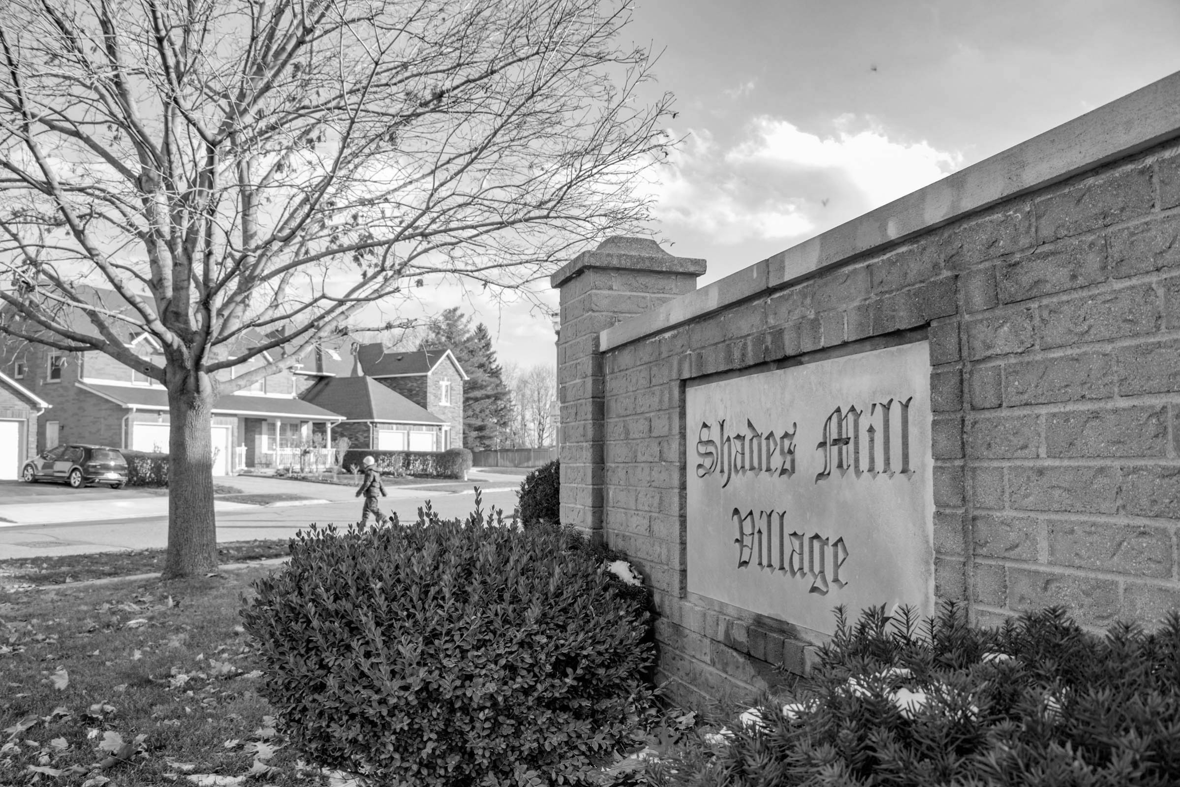 a photo of a neighbourhood sign that says Shades Mill Village