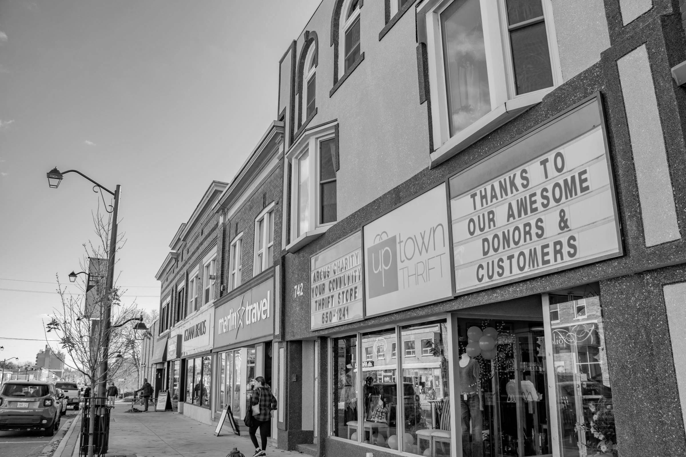 a photo of downtown Preston, you can see several stores including Uptown Thrift and Marlin Travel