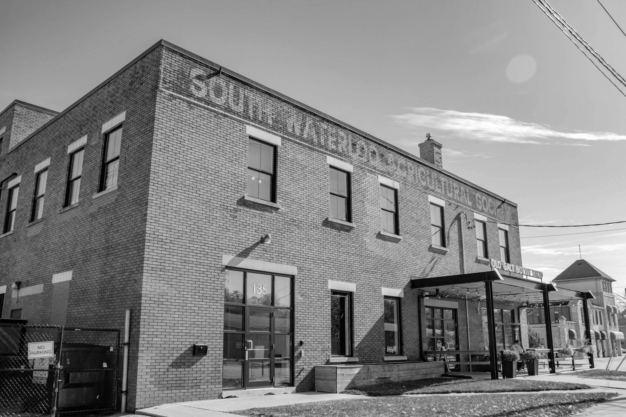 looking at the front of the south waterloo agricultural society building and the old galt bottle shop in the Blair Road neighbourhood in West Galt, Cambridge, Ontario.