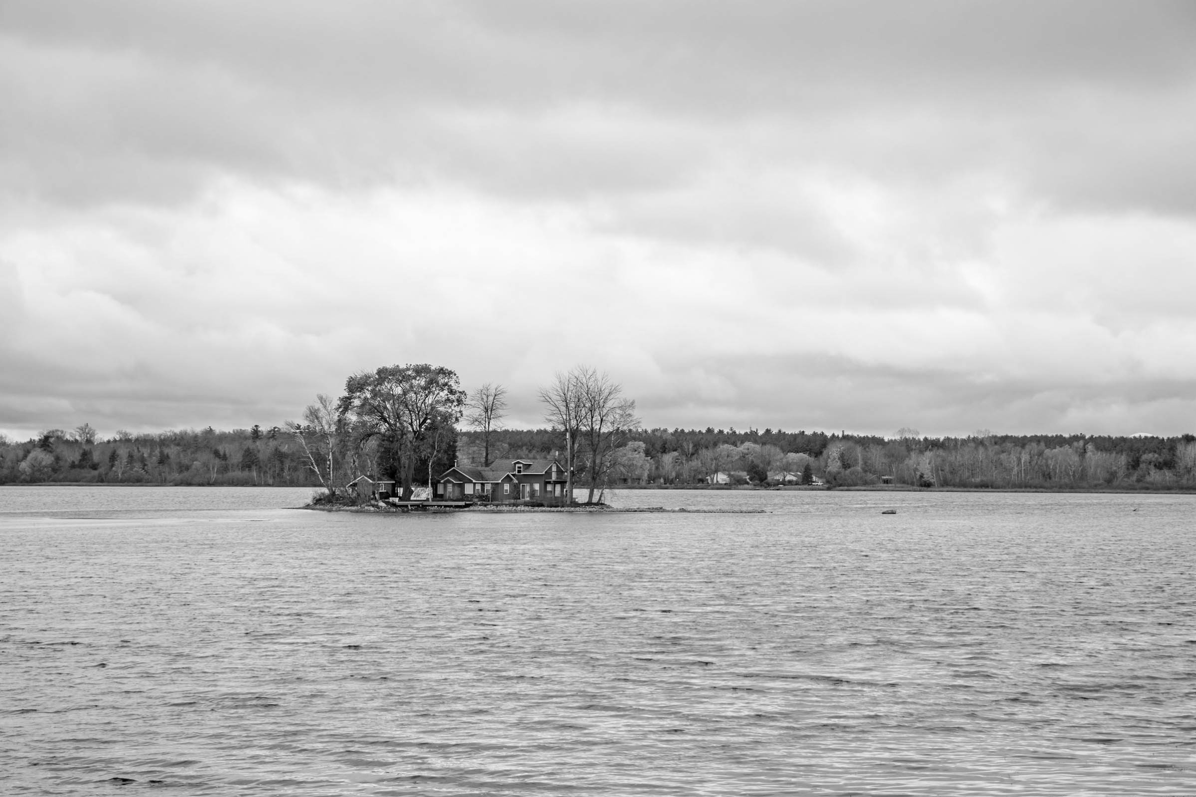 A photo looking at Puslinch Lake, you can see a home on one of the islands.